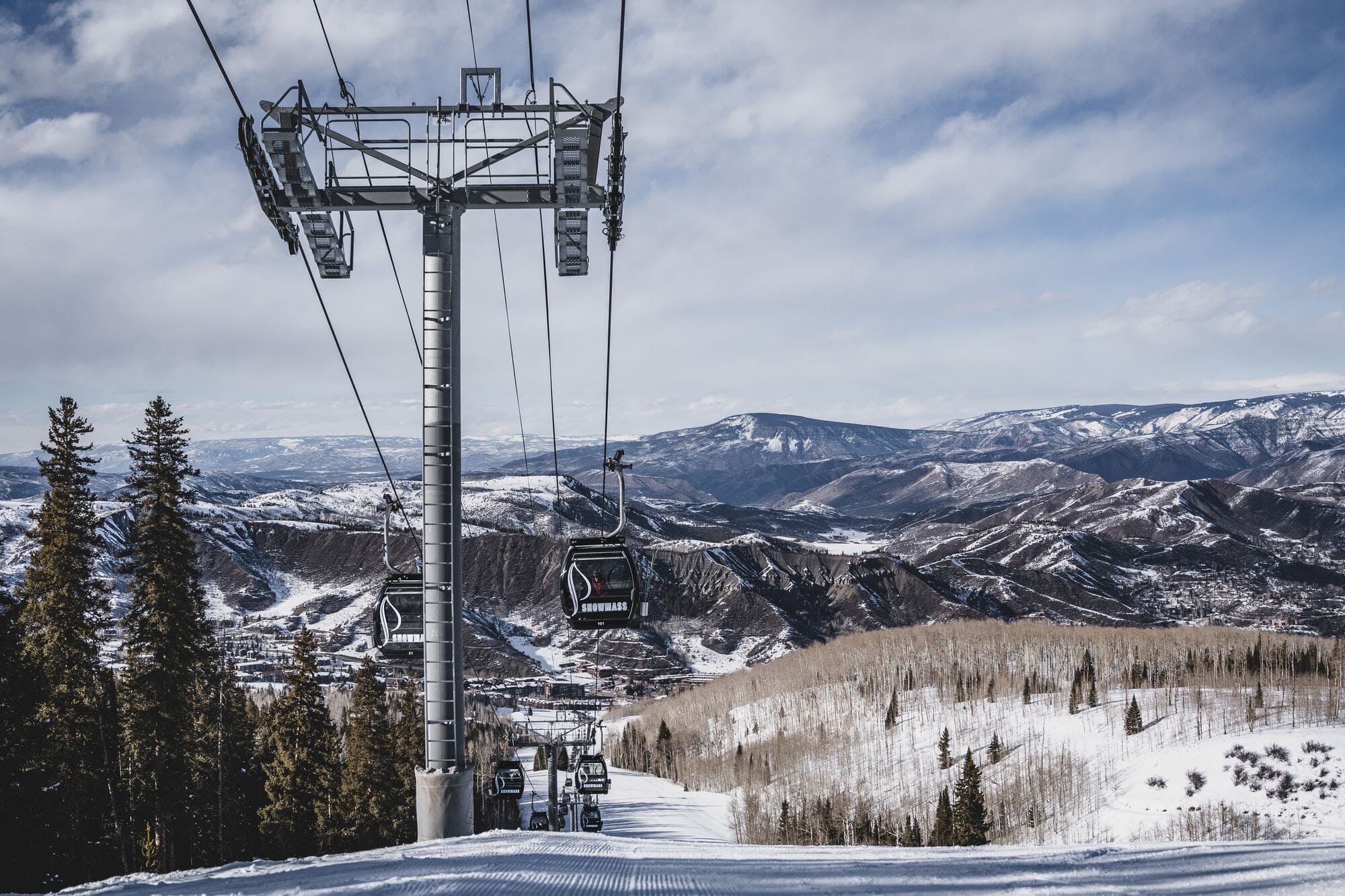 A ski lift overlooking the rocky mountains in Aspen, Colorado